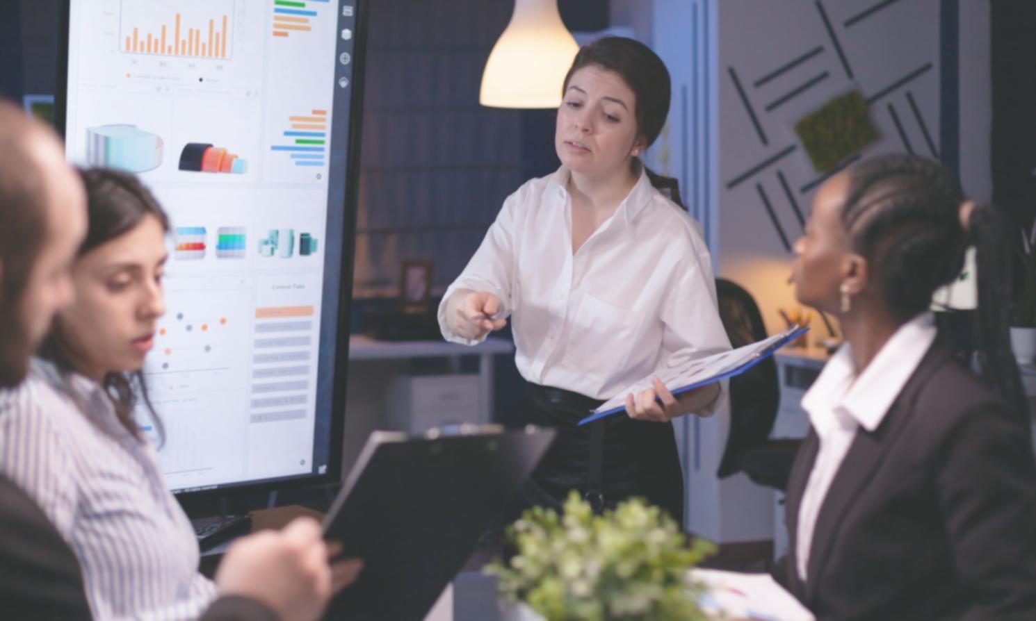 Students reviewing financial documents in collaborative learning environment
